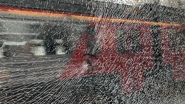 <div class="paragraphs"><p>Representative image of a damaged glass window of a train due to stone pelting.&nbsp;</p></div>