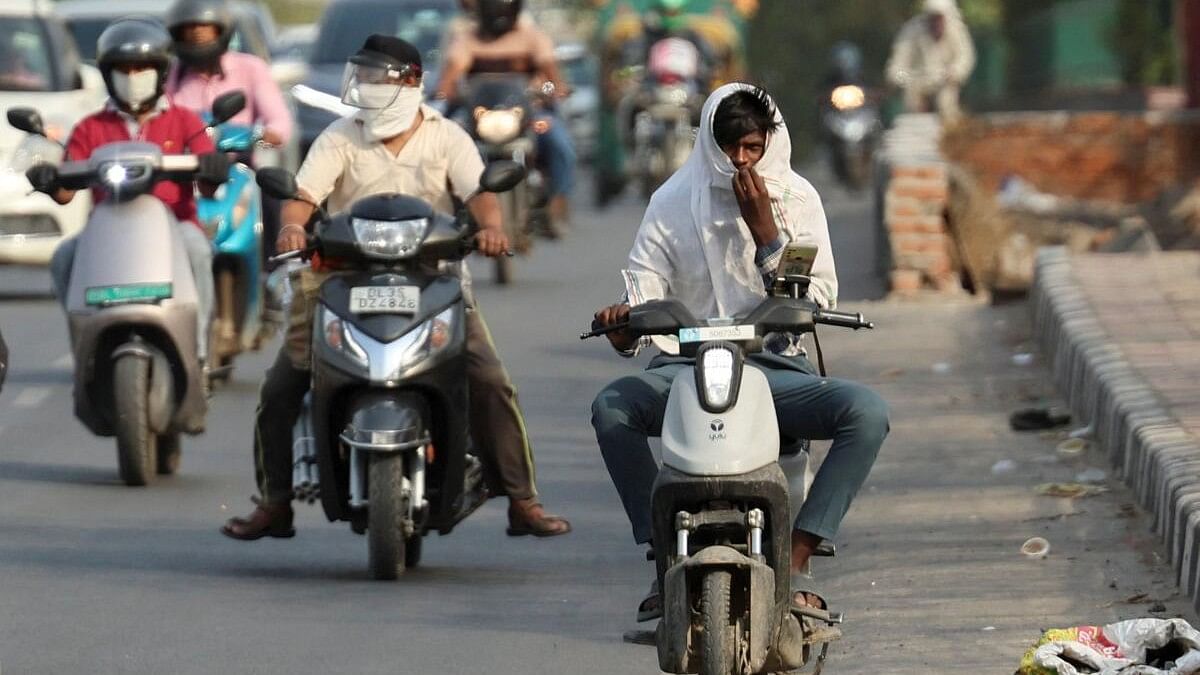 <div class="paragraphs"><p>Bikers ride on a road in Delhi amid high temperatures in the national capital.&nbsp;</p></div>