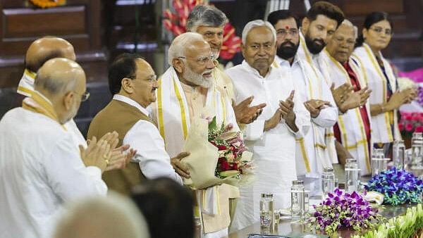 <div class="paragraphs"><p>Prime Minister Narendra Modi, centre, during the NDA parliamentary party meeting at Samvidhan Sadan, in New Delhi, Friday, June 7, 2024. </p></div>