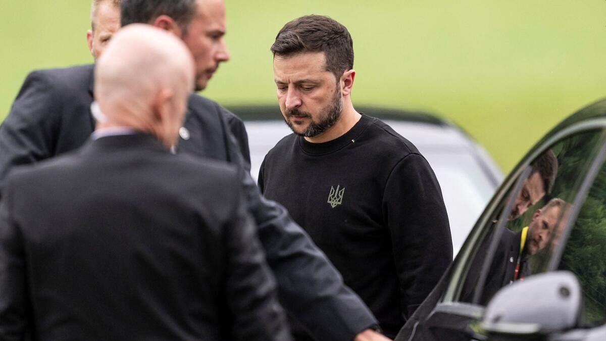 <div class="paragraphs"><p>President of Ukraine, Volodymyr Zelenskiy, right, steps toward a vehicle after his landing in Obbuergen near the Buergenstock Resort, ahead the Summit on peace in Ukraine, in Stansstad near Lucerne.</p></div>