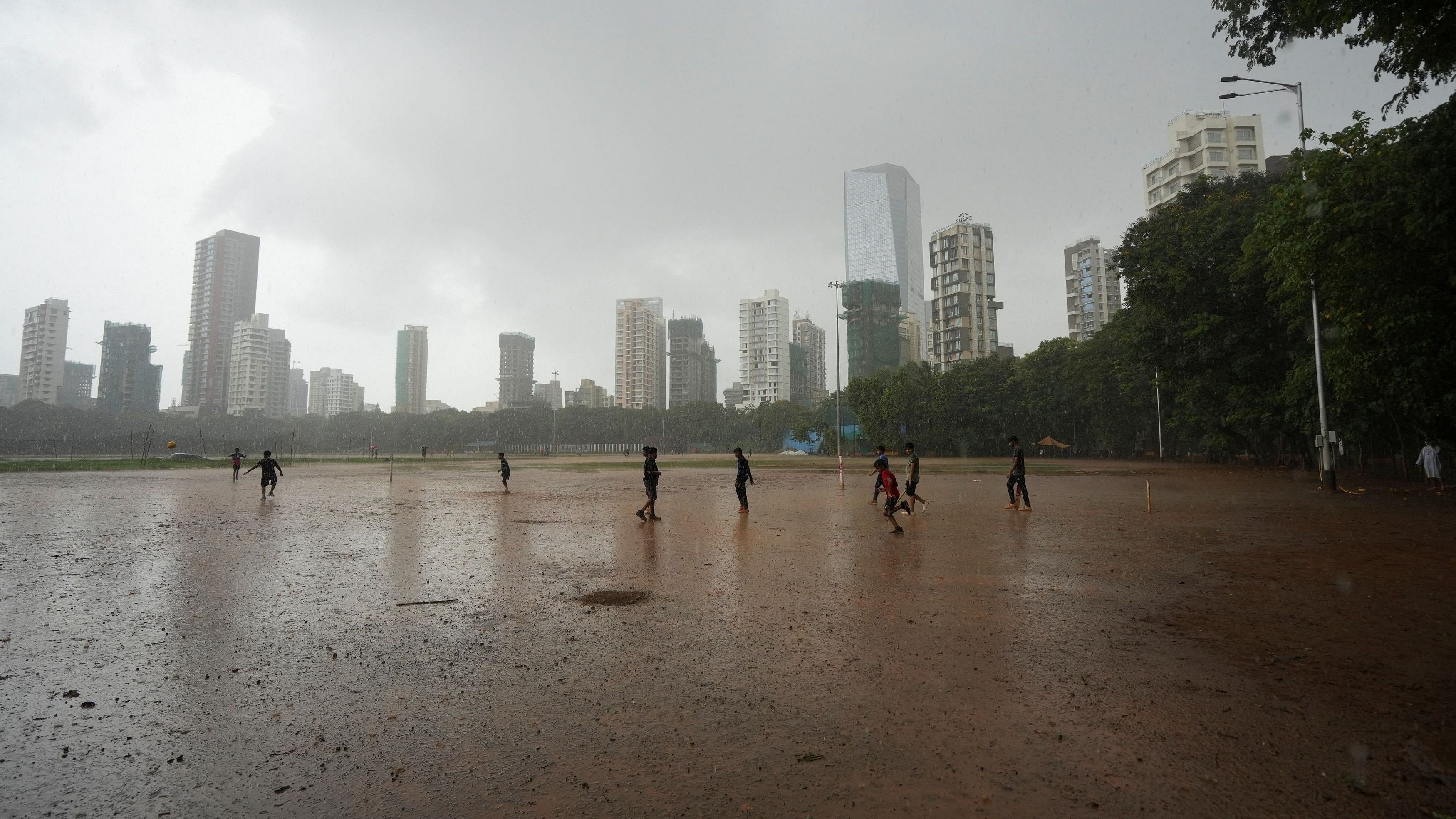 <div class="paragraphs"><p>Children play in the rain in Mumbai.</p></div>