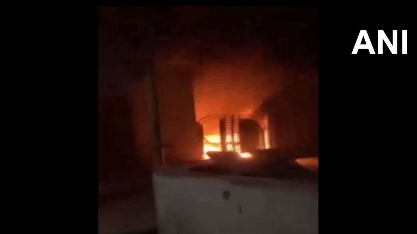 <div class="paragraphs"><p>Screengrab from a video showing the gate of building on fire.</p></div>