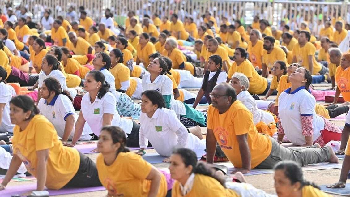 <div class="paragraphs"><p>People perform yoga in front of the Mysuru Palace on occasion of International Yoga Day.</p></div>