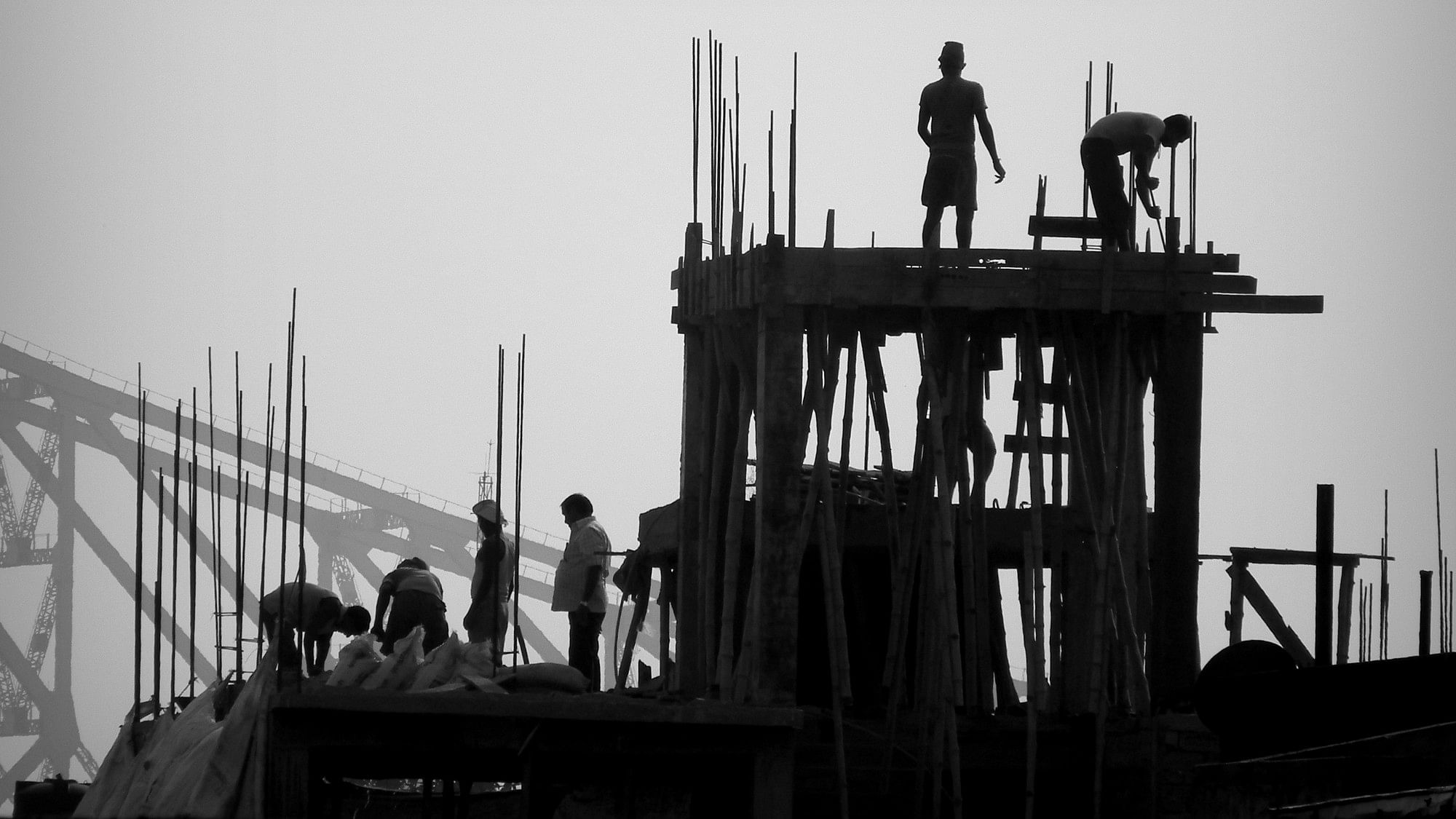<div class="paragraphs"><p>Workers at an under-construction building.</p></div>