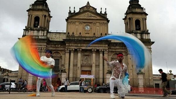 <div class="paragraphs"><p>Participants wave flags during the annual Pride Parade in Guatemala City, Guatemala, June 29, 2024. </p></div>