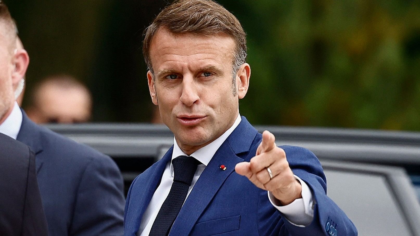 <div class="paragraphs"><p>French President Emmanuel Macron gestures, as he arrives at a polling station to to vote in the first round of the early French parliamentary elections, in Le Touquet-Paris-Plage, France, June 30, 2024.</p></div>