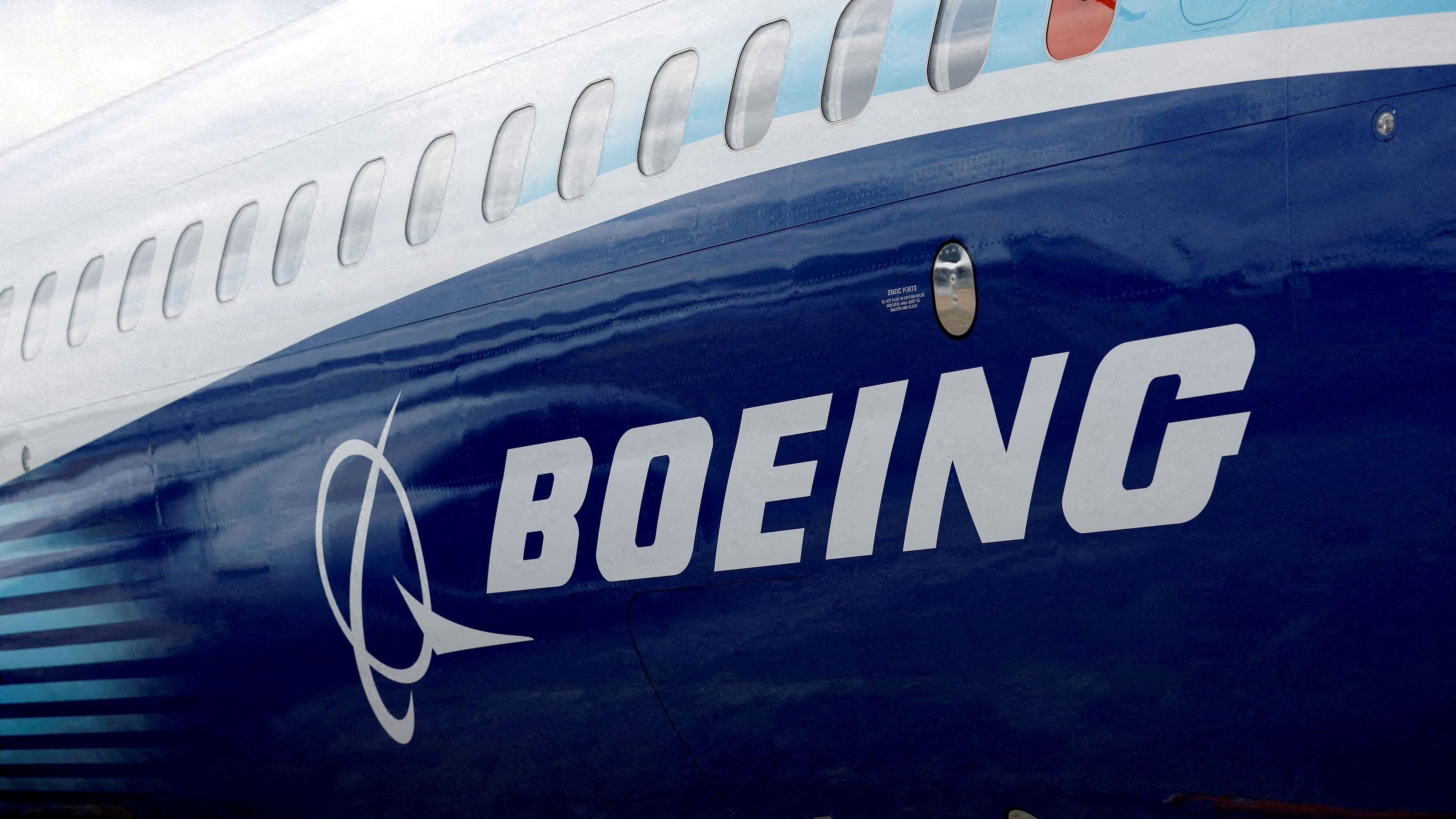 <div class="paragraphs"><p>The Boeing logo is seen on the side of a Boeing 737 MAX.</p></div>