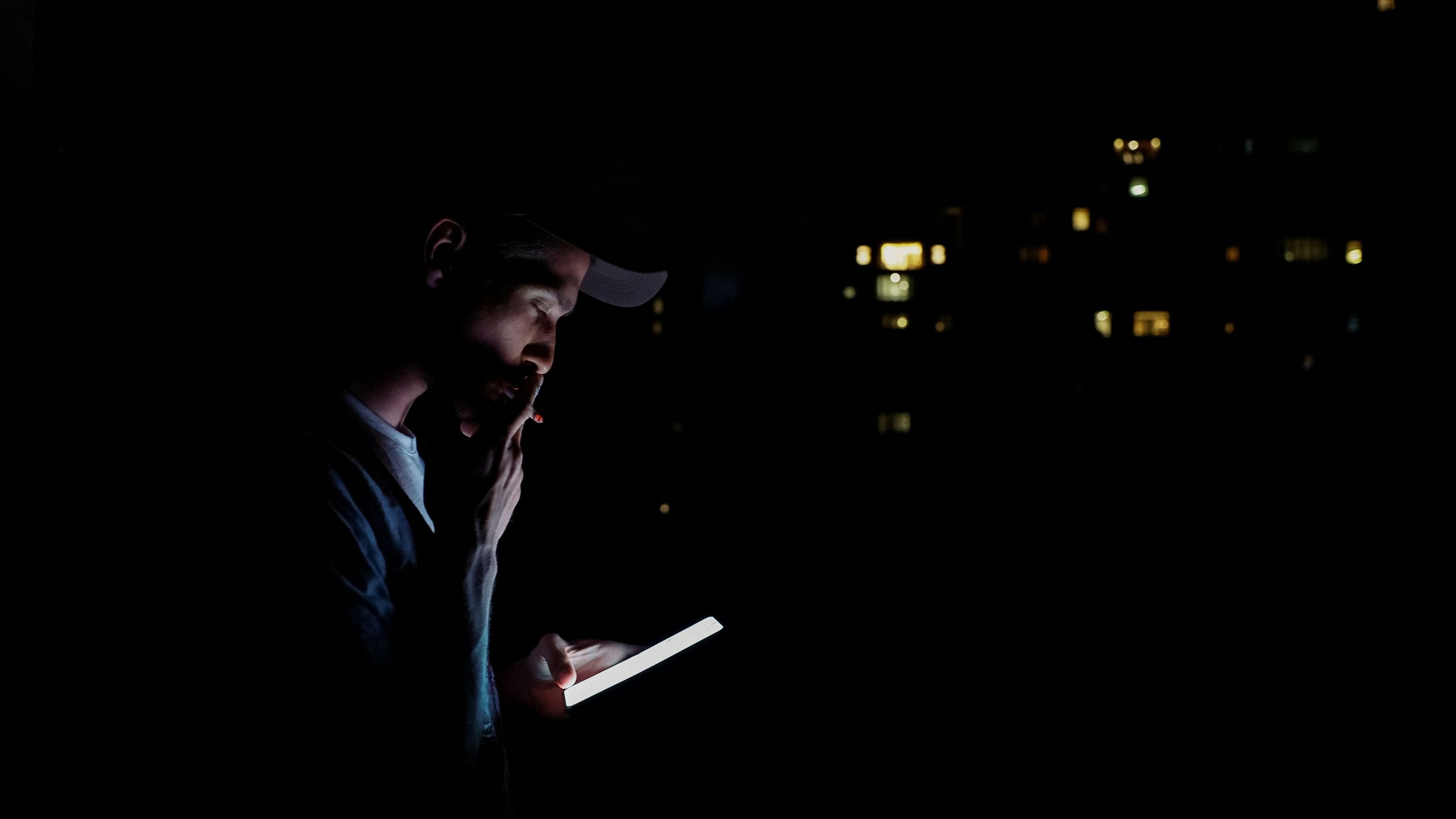 <div class="paragraphs"><p>A Ukrainian artist is pictured smoking, during a power cut in Kyiv.</p></div>