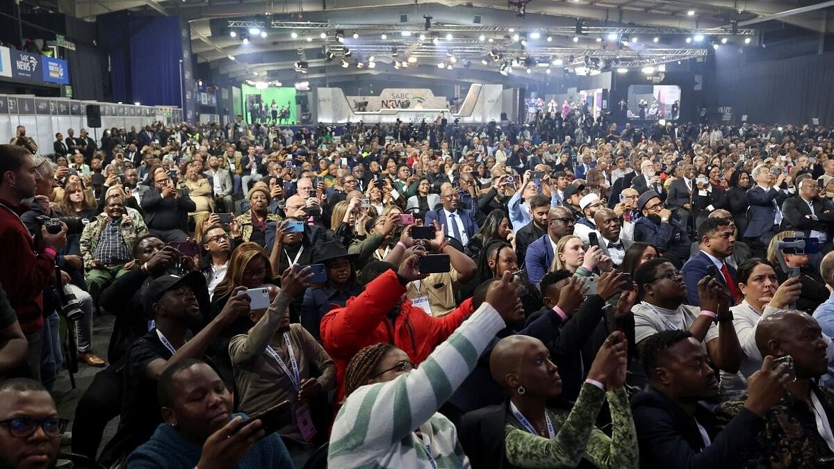 <div class="paragraphs"><p>People attend the announcement of the election results at the National Results Operation Centre of the IEC, which serves as an operational hub where results of the national election are displayed, in Midrand, South Africa.</p></div>