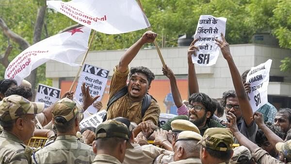 <div class="paragraphs"><p>Students stage a protest over the NEET-UG and UGC-NET examinations issue, in New Delhi.&nbsp;</p></div>
