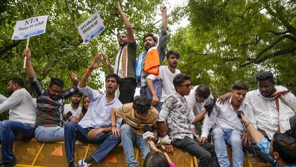 <div class="paragraphs"><p>NSUI activists raise slogans during their ‘Chhattra Sansad Gherav’ protest against the alleged irregularities in NEET-UG and cancellation of UGC-NET exams, in New Delhi, Monday, June 24, 2024. </p></div>