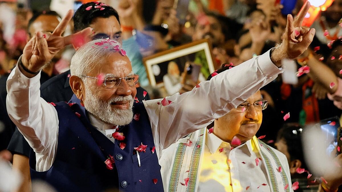 <div class="paragraphs"><p>Narendra Modi gestures as he arrives at BJP headquarters in New Delhi.</p></div>