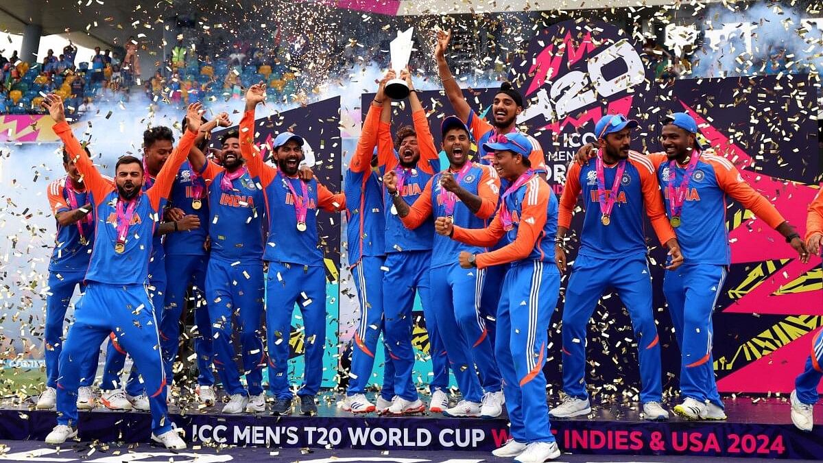 <div class="paragraphs"><p>India's Kuldeep Yadav lifts the trophy as they celebrate after winning the T20 World Cup</p></div>