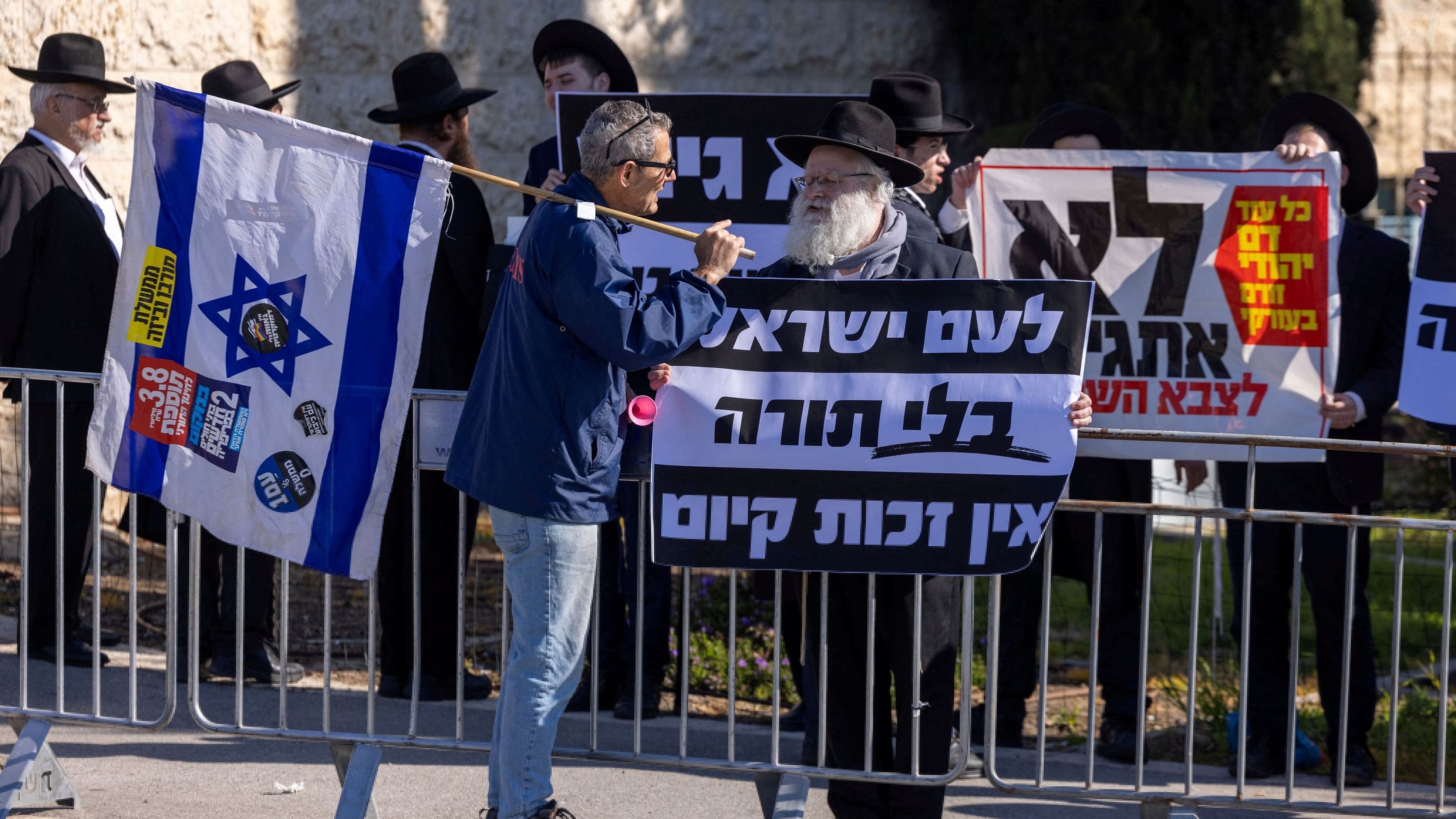 <div class="paragraphs"><p>A protester, demanding equality in Israel's military service, confronts an ultra-Orthodox Jewish man demonstrating in favour of military exemptions for religious seminary students in Jerusalem February 26, 2024.</p></div>