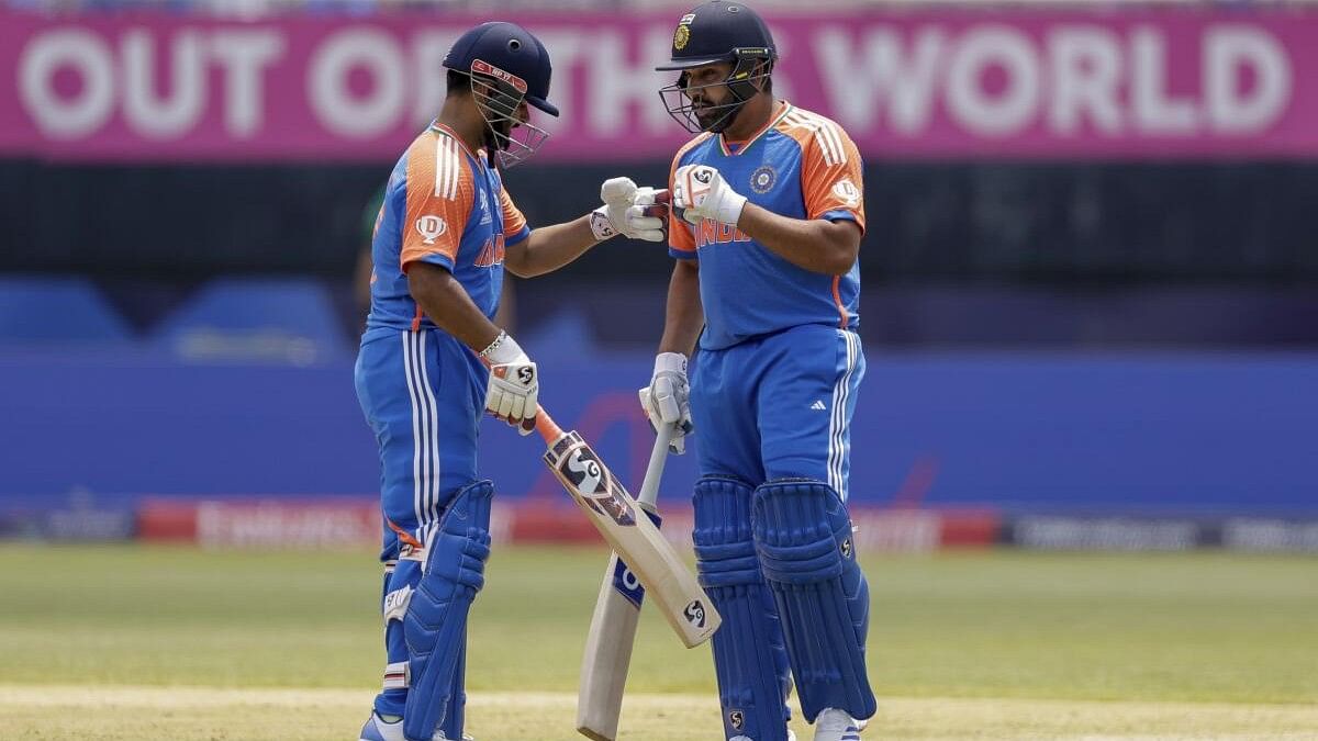 <div class="paragraphs"><p>India's Rishabh Pant, left, is congratulated by his captain Rohit Sharma after playing a shot for four runs against Ireland during an ICC Men's T20 World Cup cricket match at the Nassau County International Cricket Stadium in Westbury, New York.</p></div>