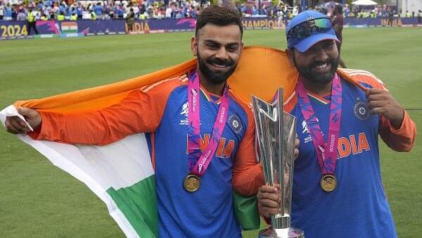 <div class="paragraphs"><p>Indian skipper Rohit Sharma seen here with teammate Virat Kohli&nbsp;pose with the winners trophy after defeating South Africa in the ICC Men's T20 World Cup final cricket match at Kensington Oval in Bridgetown, Barbados, Saturday, June 29, 2024. Both cricketers have announced their decision to quit the T20 Internationals format.</p></div>