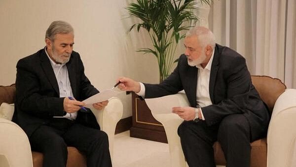 <div class="paragraphs"><p>Hamas leader Ismail Haniyeh and Islamic Jihad leader Ziyad Al Nakhalaj discuss the ceasefire proposal before they response to Qatari and Egyptian mediators in Doha.</p></div>