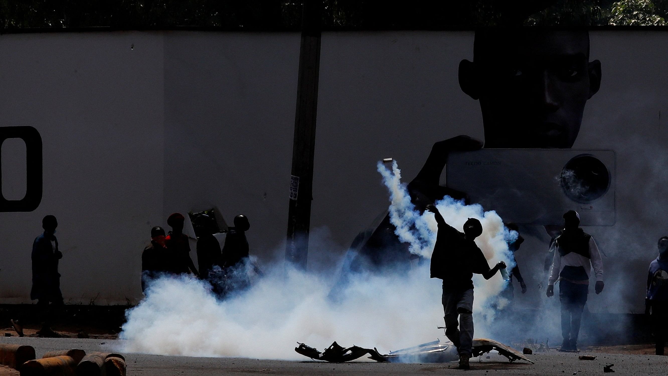<div class="paragraphs"><p>A demonstrator throws back a teargas grenade as people attend a demonstration against Kenya's proposed finance bill 2024/2025 in Nairobi, Kenya, June 25, 2024. </p></div>