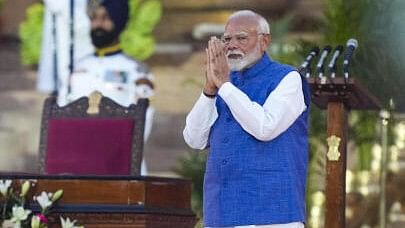 <div class="paragraphs"><p>Narendra Modi greets as he arrives to take oath as prime minister for the third consecutive term, at Rashtrapati Bhavan in New Delhi.&nbsp;</p></div>