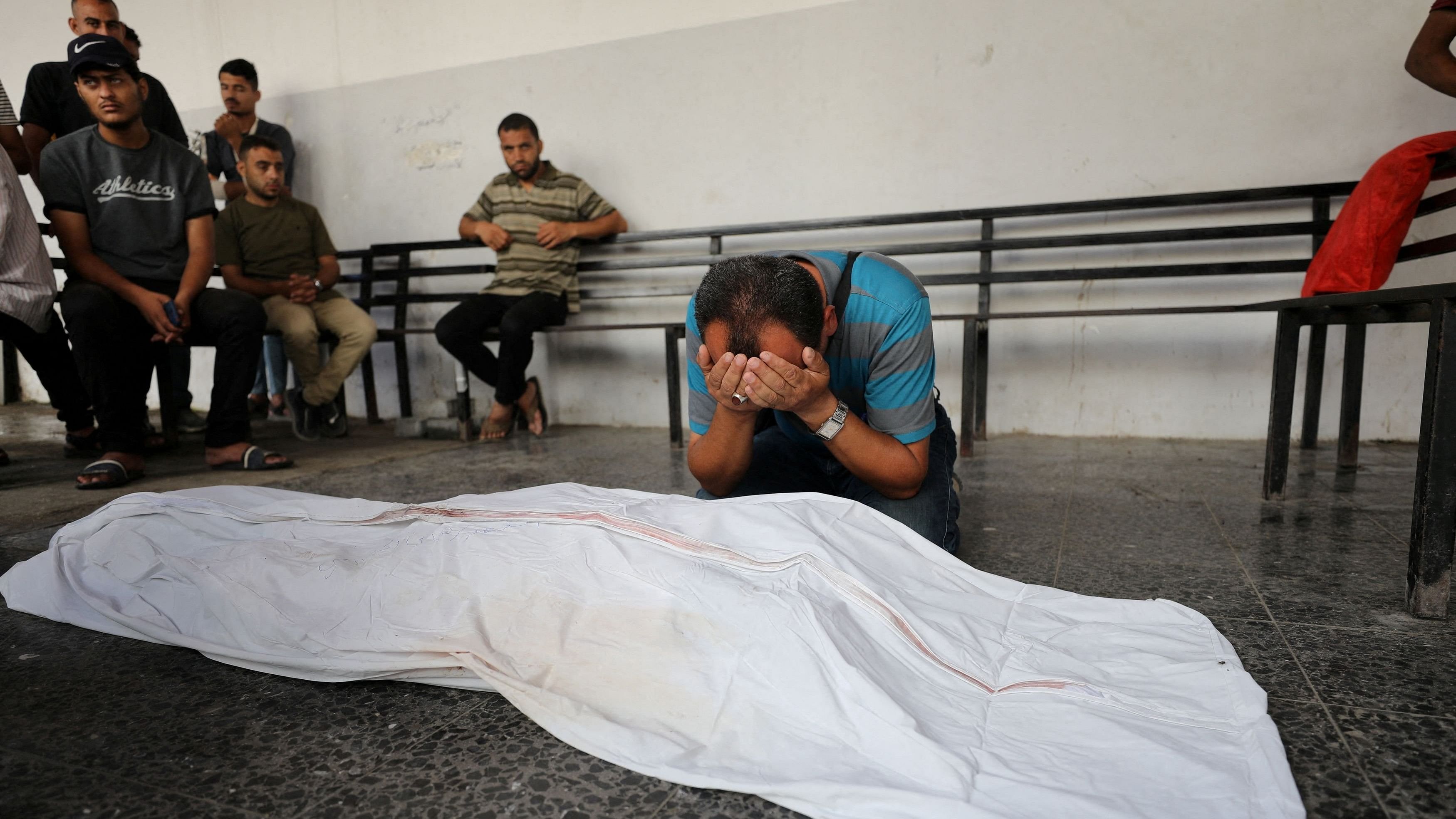 <div class="paragraphs"><p>Mourners attend the funeral of Palestinian Hani Al-Jaafarwi, the director of ambulance and emergency services at the ministry of health, who was killed in an Israeli strike on Al-Daraj clinic, amid the Israel-Hamas conflict, in Gaza City.</p></div>