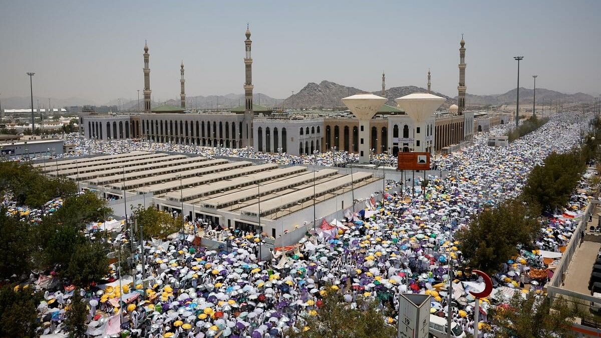 <div class="paragraphs"><p>Muslim pilgrims use umbrellas to shield themselves from the sun as they gather outside Nimrah Mosque during the annual haj pilgrimage, outside the holy city of Mecca, Saudi Arabia, June 15, 2024.</p></div>