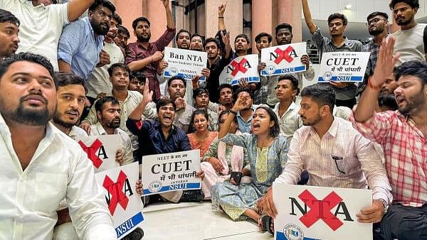 <div class="paragraphs"><p>Members of NSUI, Congress's students wing, raise slogans during their protest over the alleged rigging of the NEET UG exam.&nbsp;</p></div>