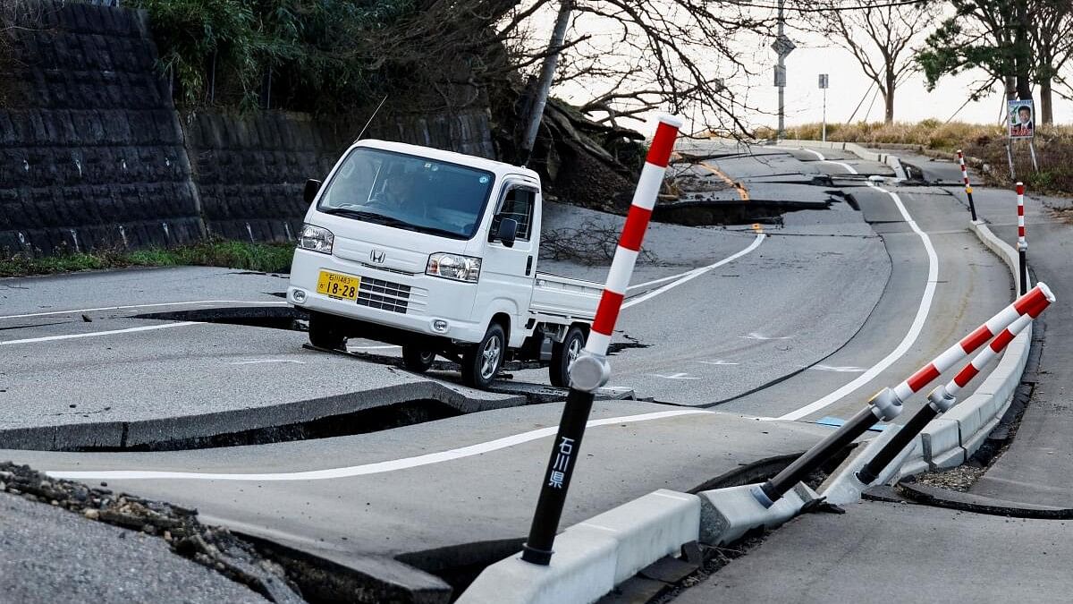 <div class="paragraphs"><p>Nakamae drives his car on a damaged road as he heads to his town Soryomachi, which is isolated after the earthquake, in Wajima, Ishikawa Prefecture, Japa.</p></div>