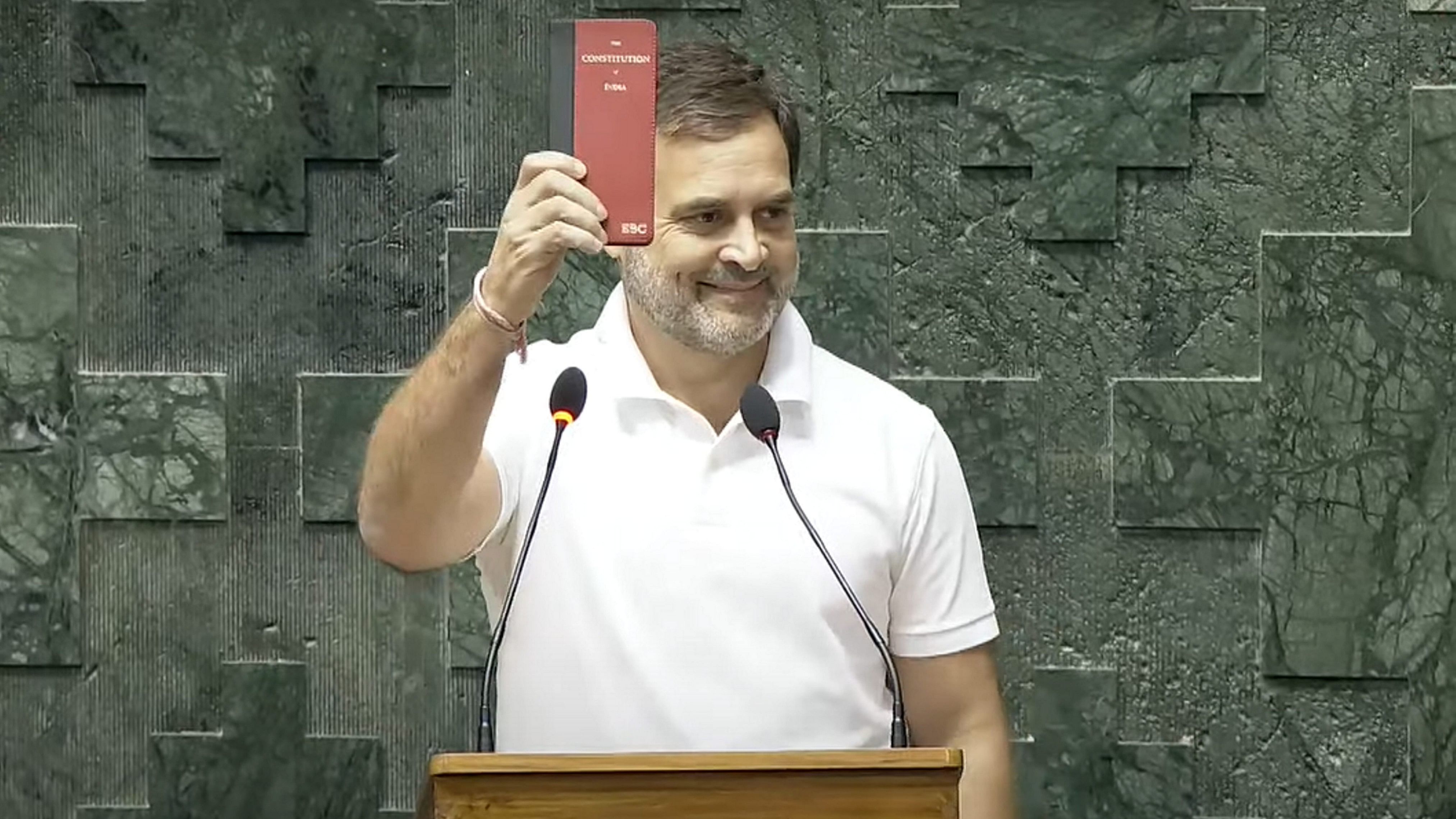 <div class="paragraphs"><p> Congress MP Rahul Gandhi shows a copy of the Constitution of India as he takes oath as a member of the House during the first session of the 18th Lok Sabha, in New Delhi on June 25, 2024. </p></div>