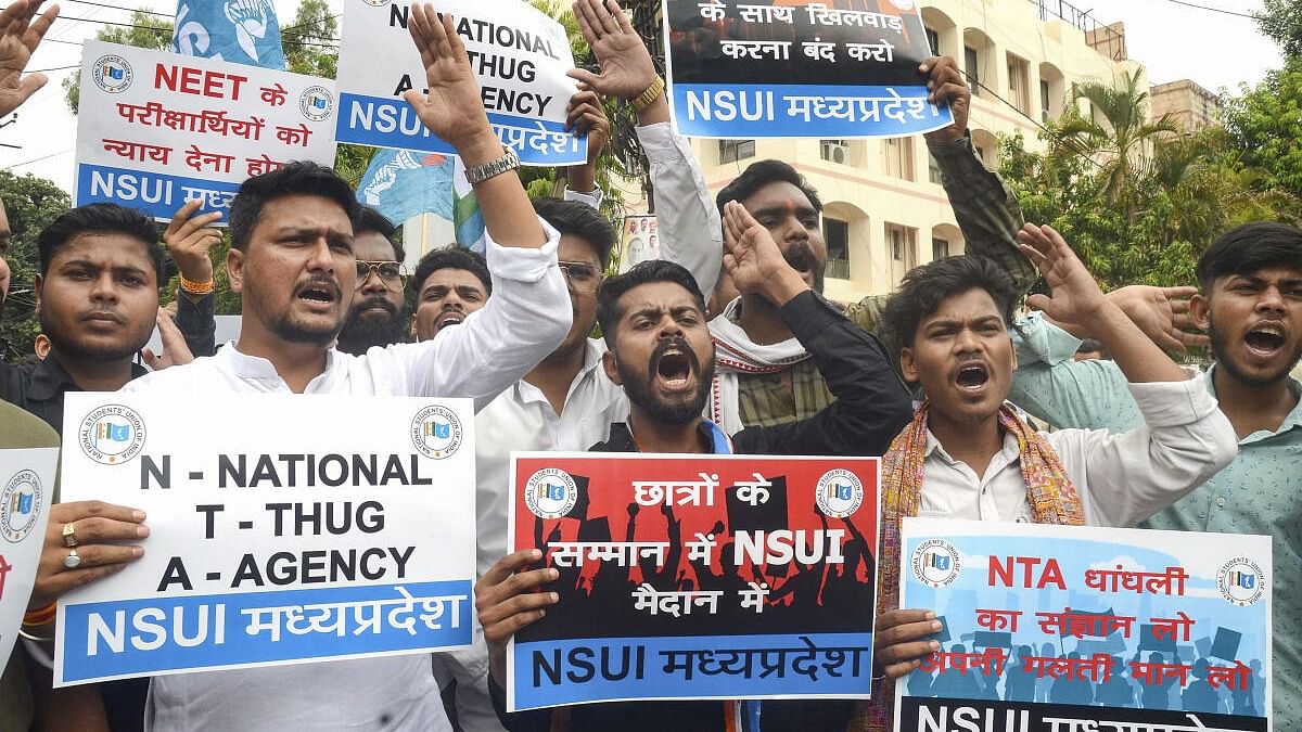<div class="paragraphs"><p>National Student Union of India (NSUI) members stage a protest against the National Testing Agency (NTA) over the alleged irregularities in the NEET-UG 2024 entrance exam results.</p></div>