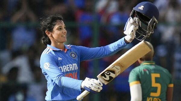 <div class="paragraphs"><p>Indian batter Smriti Mandhana celebrates her century during the first women's ODI cricket match between India and South Africa at M Chinnaswamy Stadium, in Bengaluru, Sunday, June 16, 2024.</p></div>