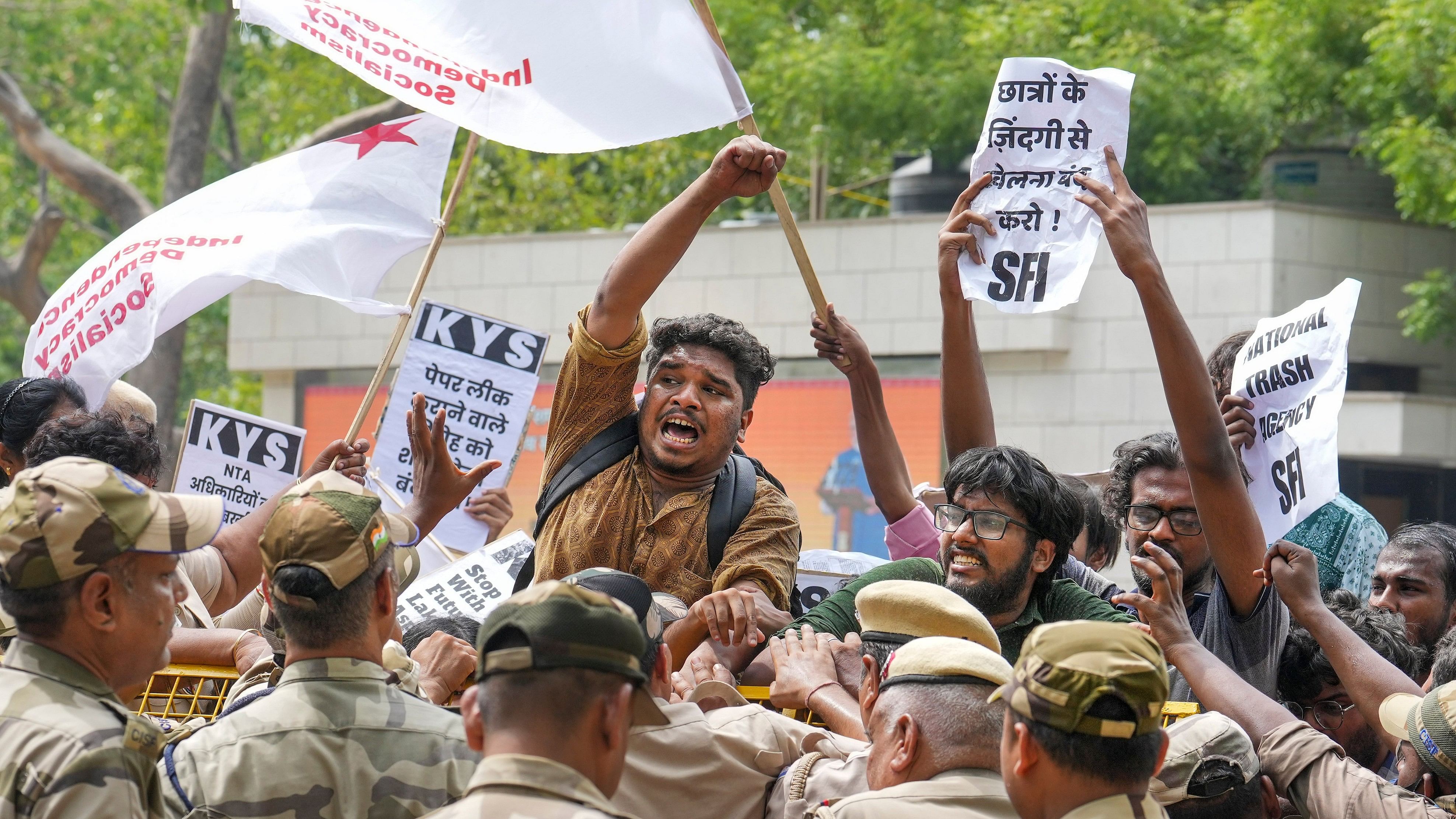 <div class="paragraphs"><p>Students stage a protest over the NEET-UG and UGC-NET examinations issue, in New Delhi,</p></div>
