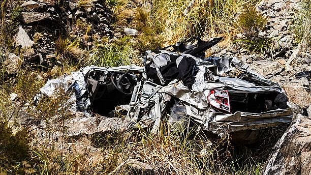 <div class="paragraphs"><p>Representative image of a car wreckage in a gorge.</p></div>