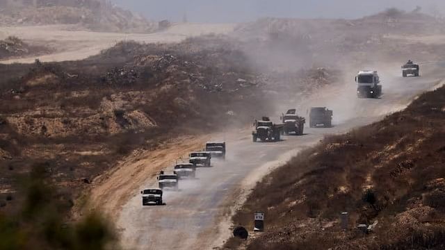 <div class="paragraphs"><p>An Israeli military convoy moves inside the Gaza Strip, amid the ongoing conflict between Israel and Hamas.</p></div>