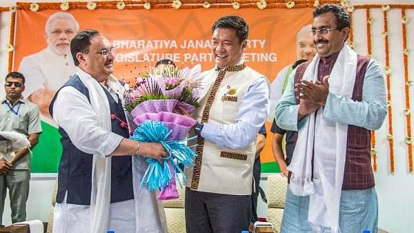 <div class="paragraphs"><p>Pema Khandu being felicitated by BJP leader J P Nadda.</p></div>