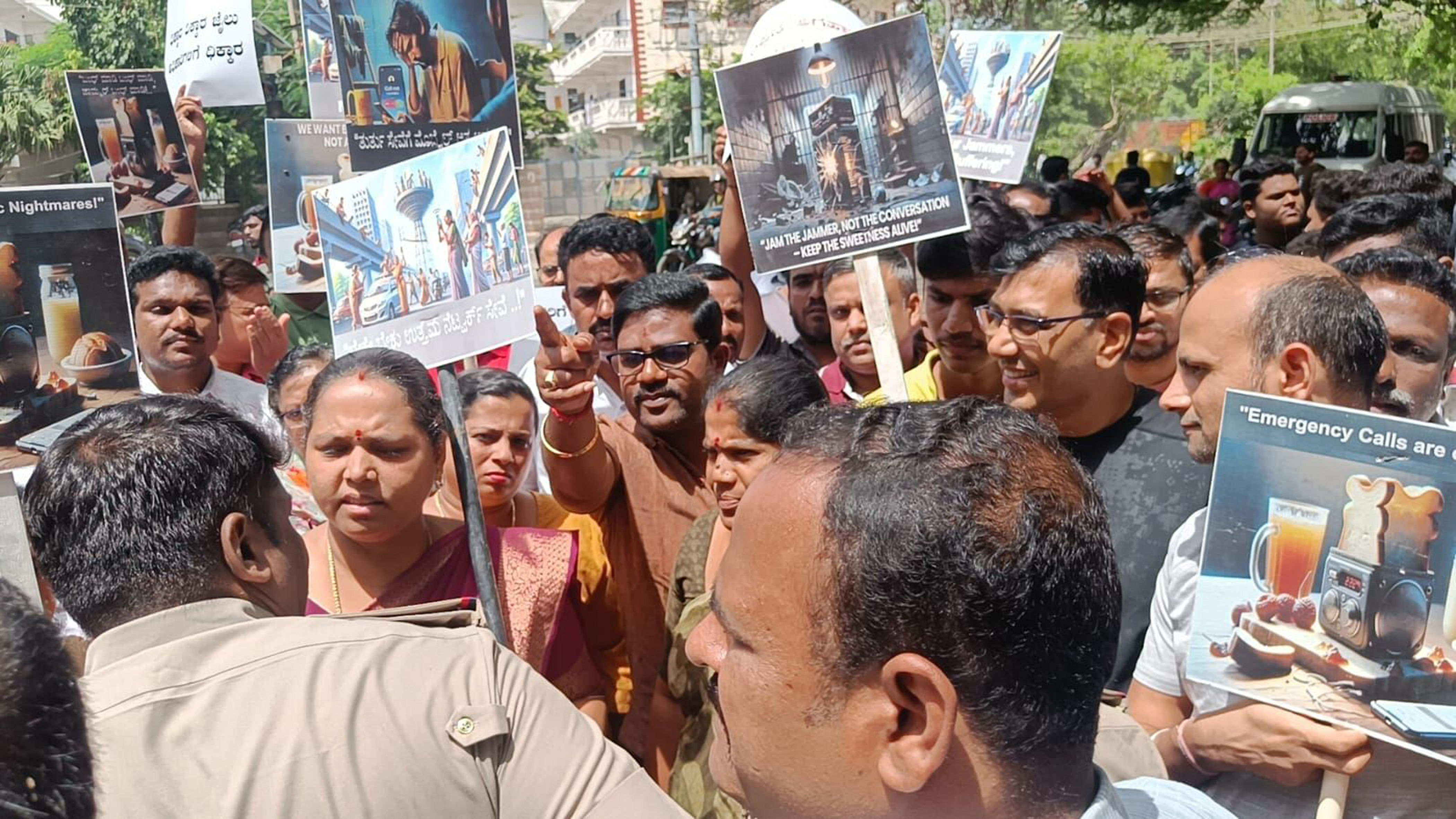 <div class="paragraphs"><p>Residents stage a protest at Jail Circle, Parappana Agrahara, on Saturday, demanding the removal of jammers or restricting their coverage area.</p></div>