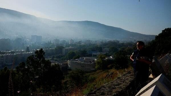 <div class="paragraphs"><p>Smoke rises, amid ongoing cross-border hostilities between Hezbollah and Israeli forces, as seen from Kiryat Shmona, northern Israel.&nbsp;</p></div>