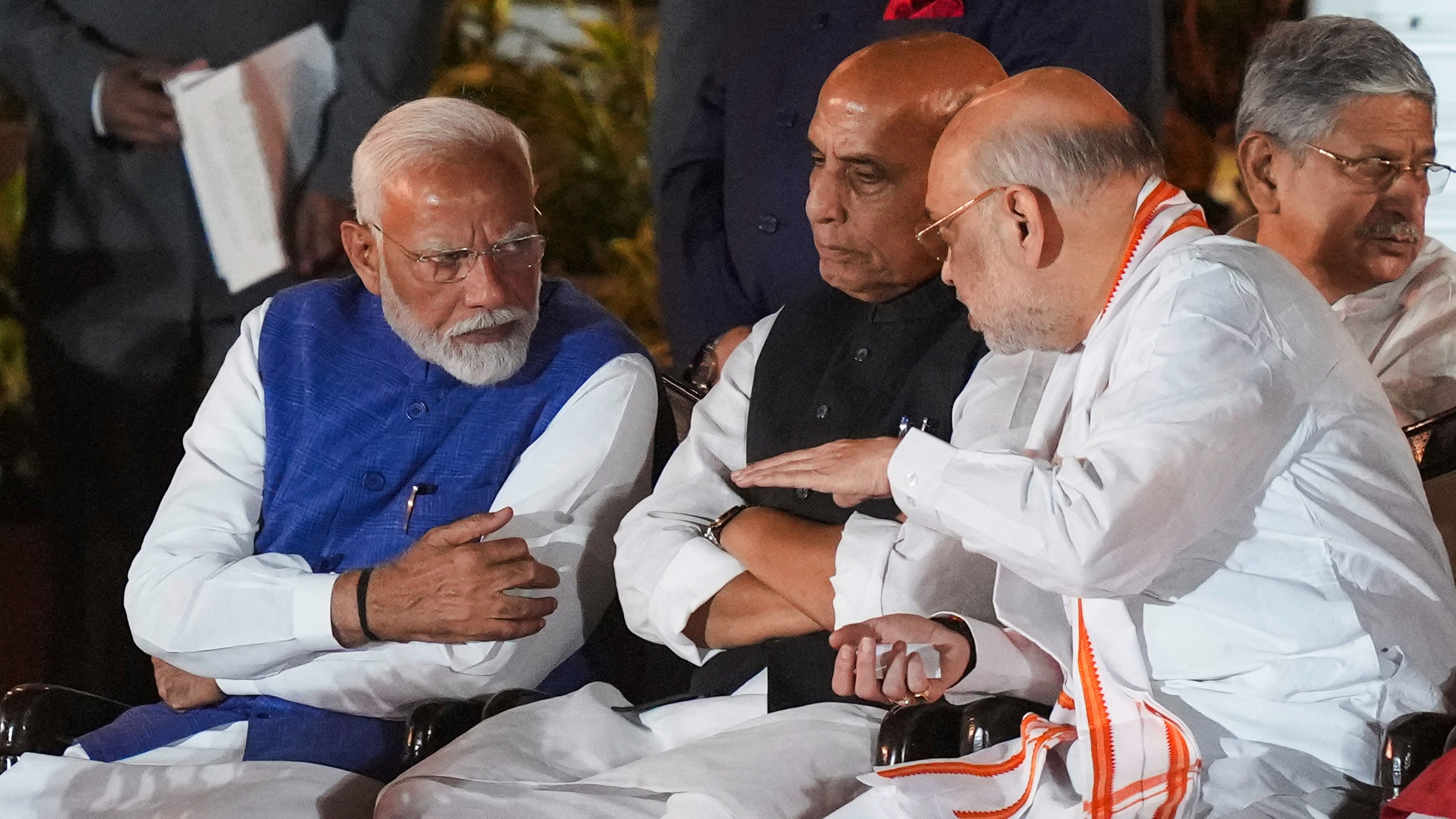 <div class="paragraphs"><p>Prime Minister-designate Narendra Modi with MP-elects Rajnath Singh and Amit Shah</p></div>