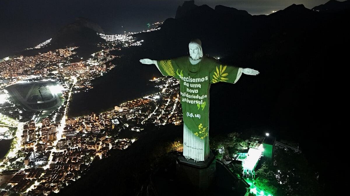 <div class="paragraphs"><p>A drone view shows the Christ the Redeemer statue with a projected message from Pope Francis' encyclical "Laudato Si", in Rio de Janeiro, Brazil June 6, 2024.</p></div>