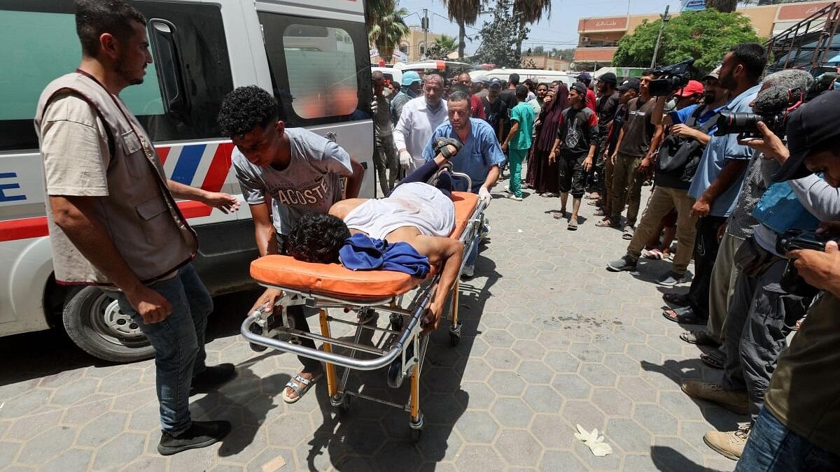 <div class="paragraphs"><p>Palestinians carry a casualty on a stretcher in the aftermath of an Israeli strike, amid the Israel-Hamas conflict, at Al-Aqsa Martyrs Hospital in Gaza.&nbsp;&nbsp;</p></div>