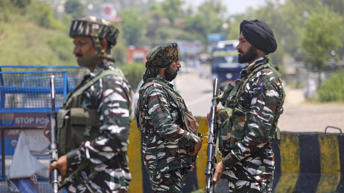 <div class="paragraphs"><p>Central Reserve Police Force (CRPF) personnel stand guard at the national highway ahead of the annual Amarnath Yatra, in Jammu</p></div>