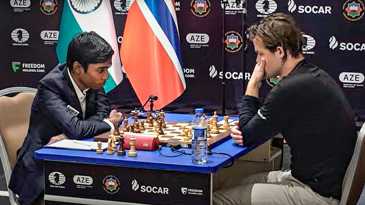 <div class="paragraphs"><p> Indian Grandmaster R Praggnanandhaa and Norway's Grandmaster and World No 1 player Magnus Carlsen .  </p></div>