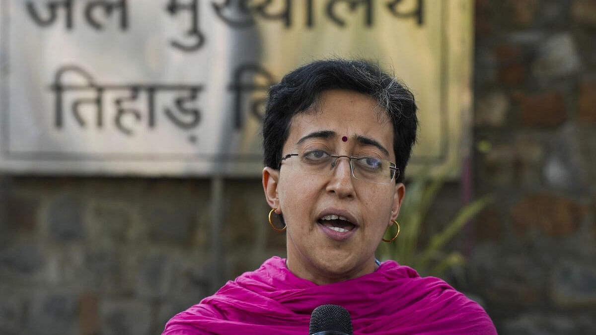 <div class="paragraphs"><p>Delhi minister and AAP leader Atishi Singh speaks with the media outside Tihar jail, in New Delhi.</p></div>