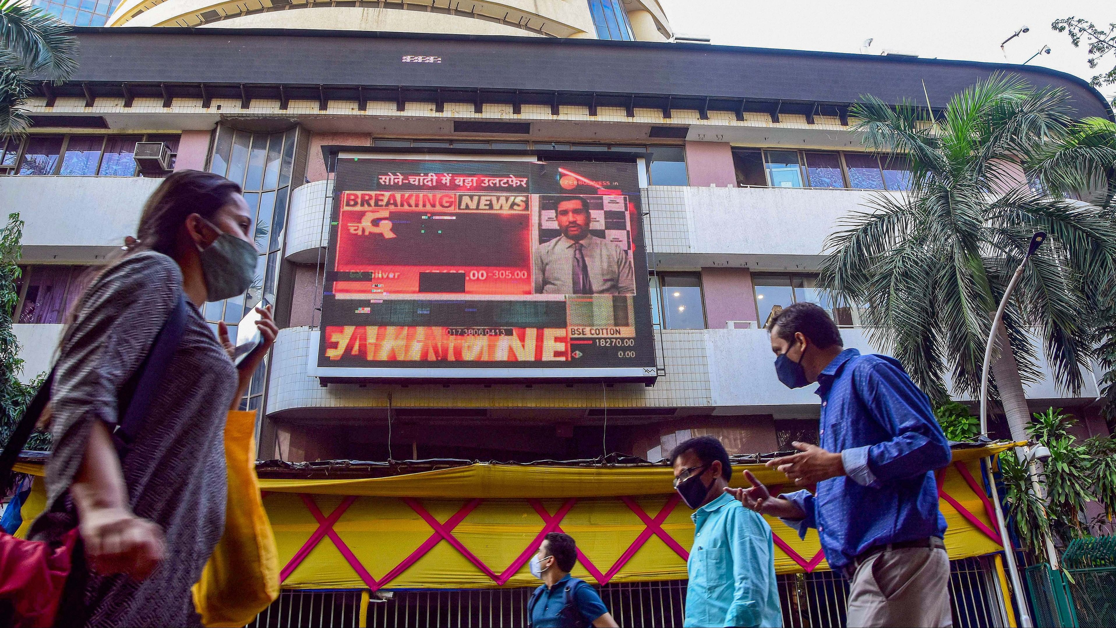 <div class="paragraphs"><p>People walk past the Bombay Stock Exchange (BSE) building in Mumbai.</p></div>