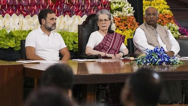 <div class="paragraphs"><p>Congress President Mallikarjun Kharge with Congress Parliamentary Party (CPP) Chairperson Sonia Gandhi and party leader Rahul Gandhi during the Congress Parliamentary Party meeting, at the Central Hall of Parliament, in New Delhi, Saturday.</p></div>