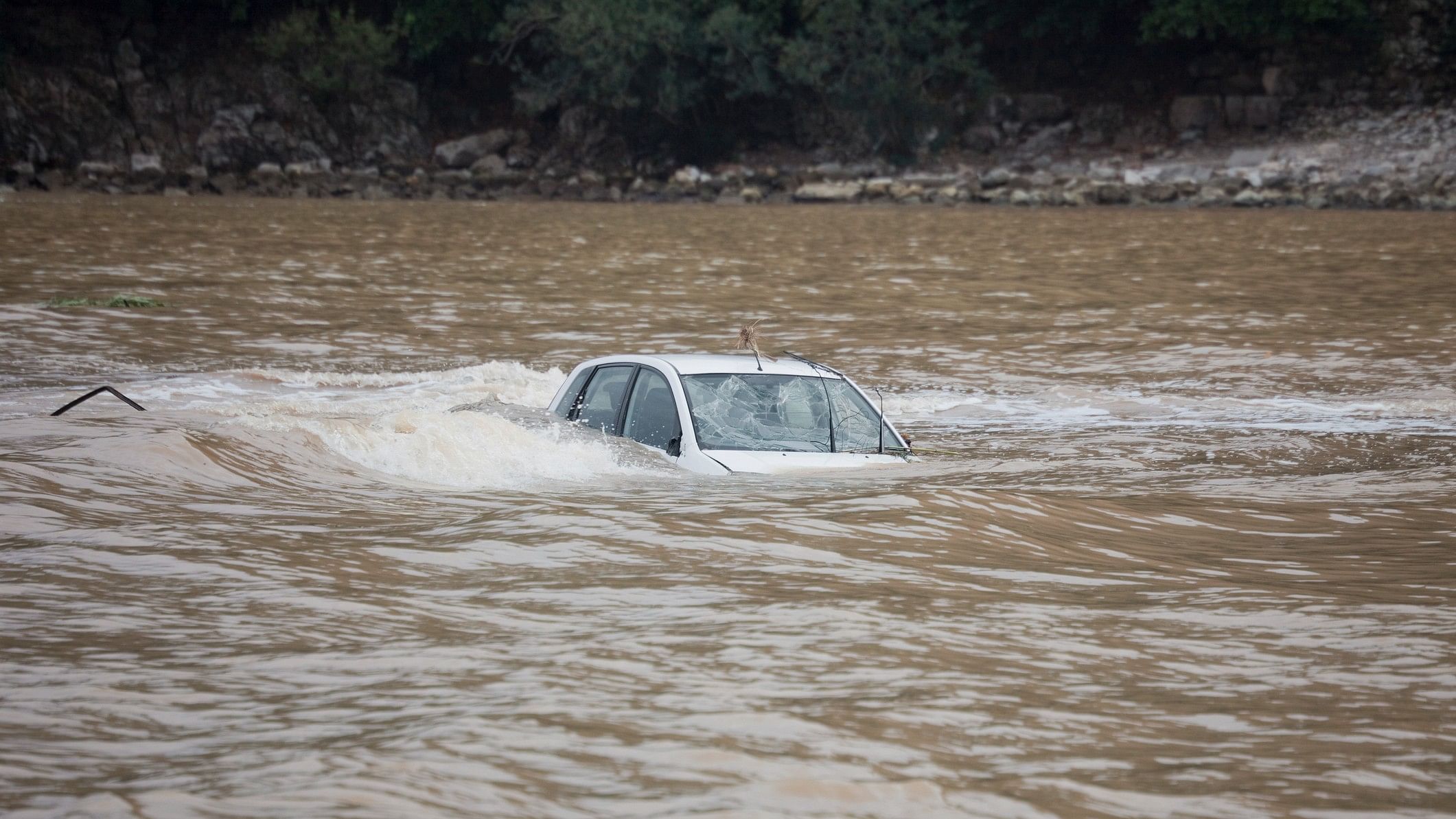 <div class="paragraphs"><p>Representative image of car submerged in river.</p></div>