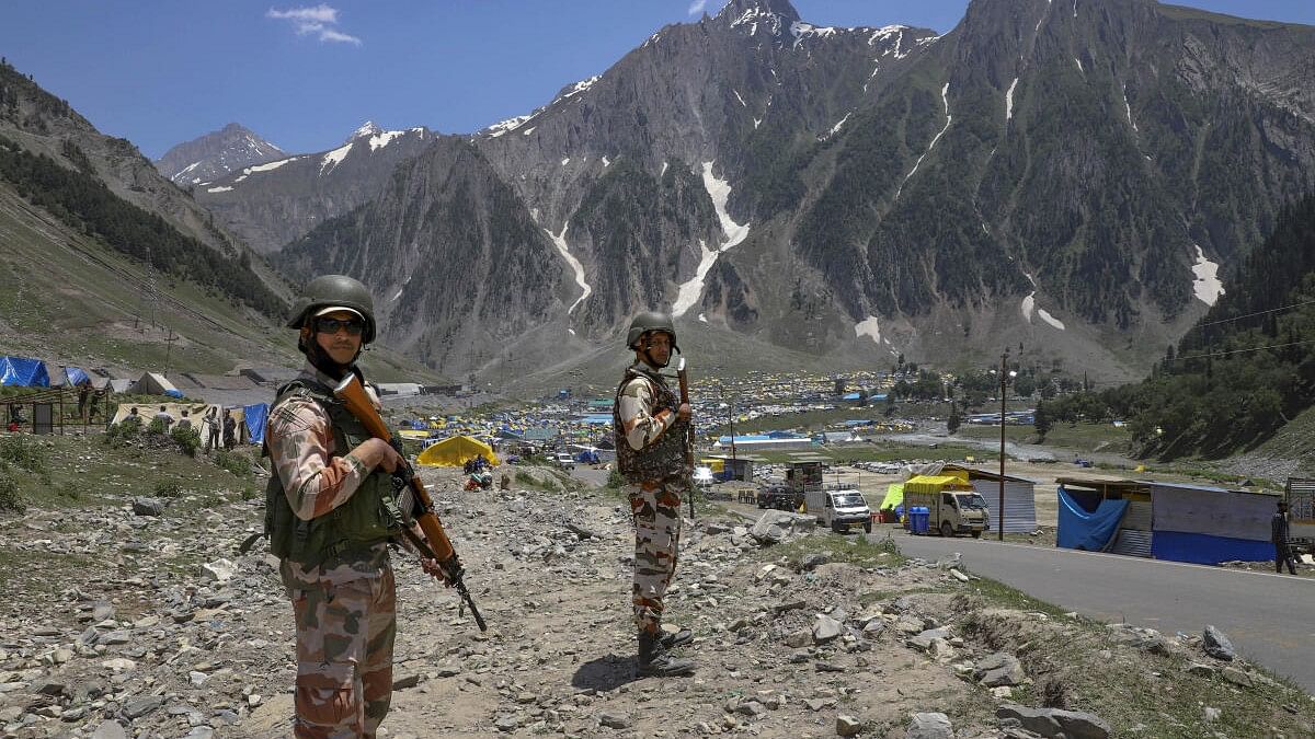 <div class="paragraphs"><p>Security personnel stand guard at an Amarnath base camp ahead of the commencement of the annual Amarnath Yatra, at Baltal in Ganderbal district, Jammu &amp; Kashmir.</p></div>