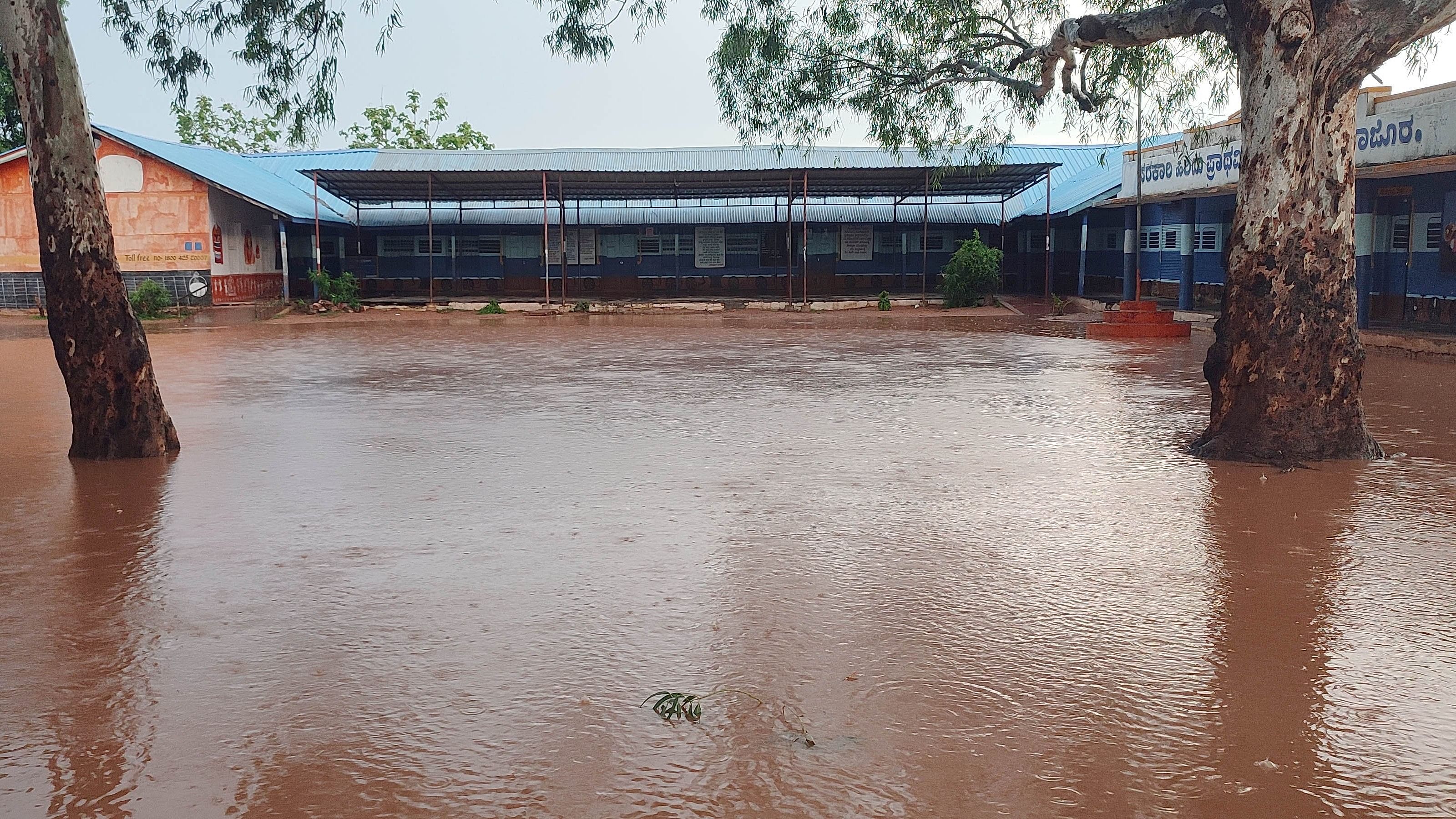 <div class="paragraphs"><p>The premises of government higher primary school at Rajoor near Gajendragad, Gadag district. is flooded following the incessant rains.</p></div>