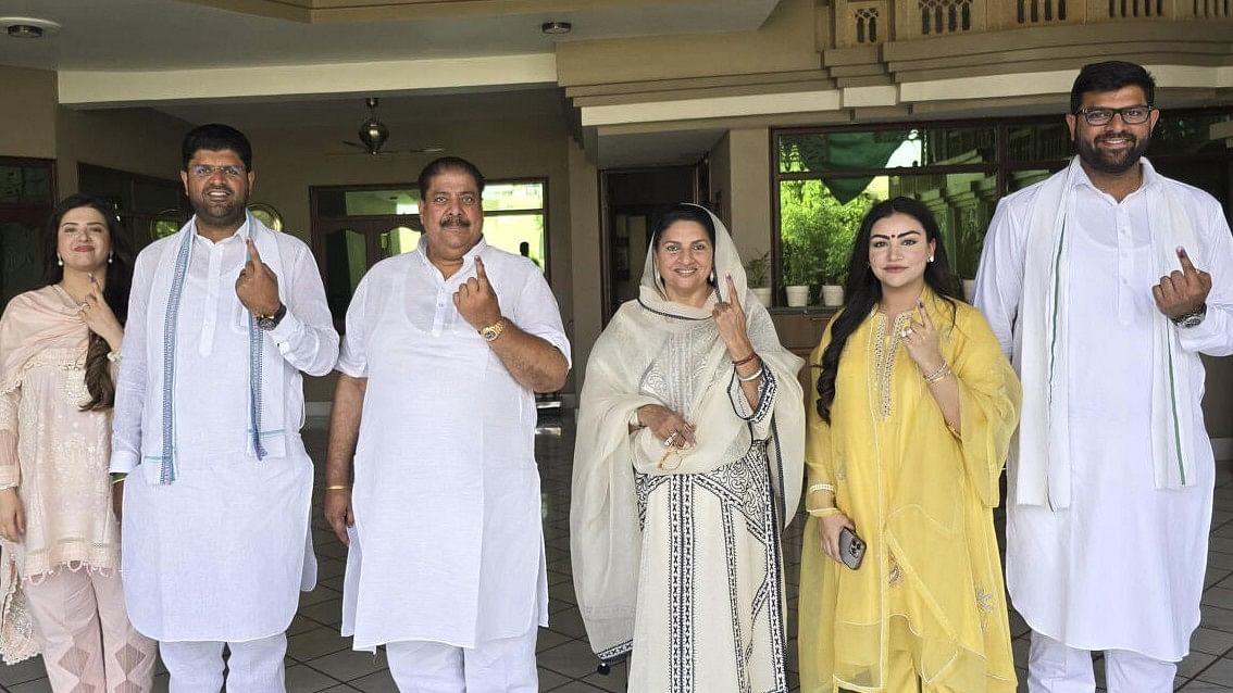 <div class="paragraphs"><p>File photo:&nbsp;Former Haryana deputy chief minister Dushyant Chautala, his father and former MP Ajay Singh Chautala and other family members show their fingers marked with indelible ink after casting their votes during the sixth phase of Lok Sabha elections.</p></div>