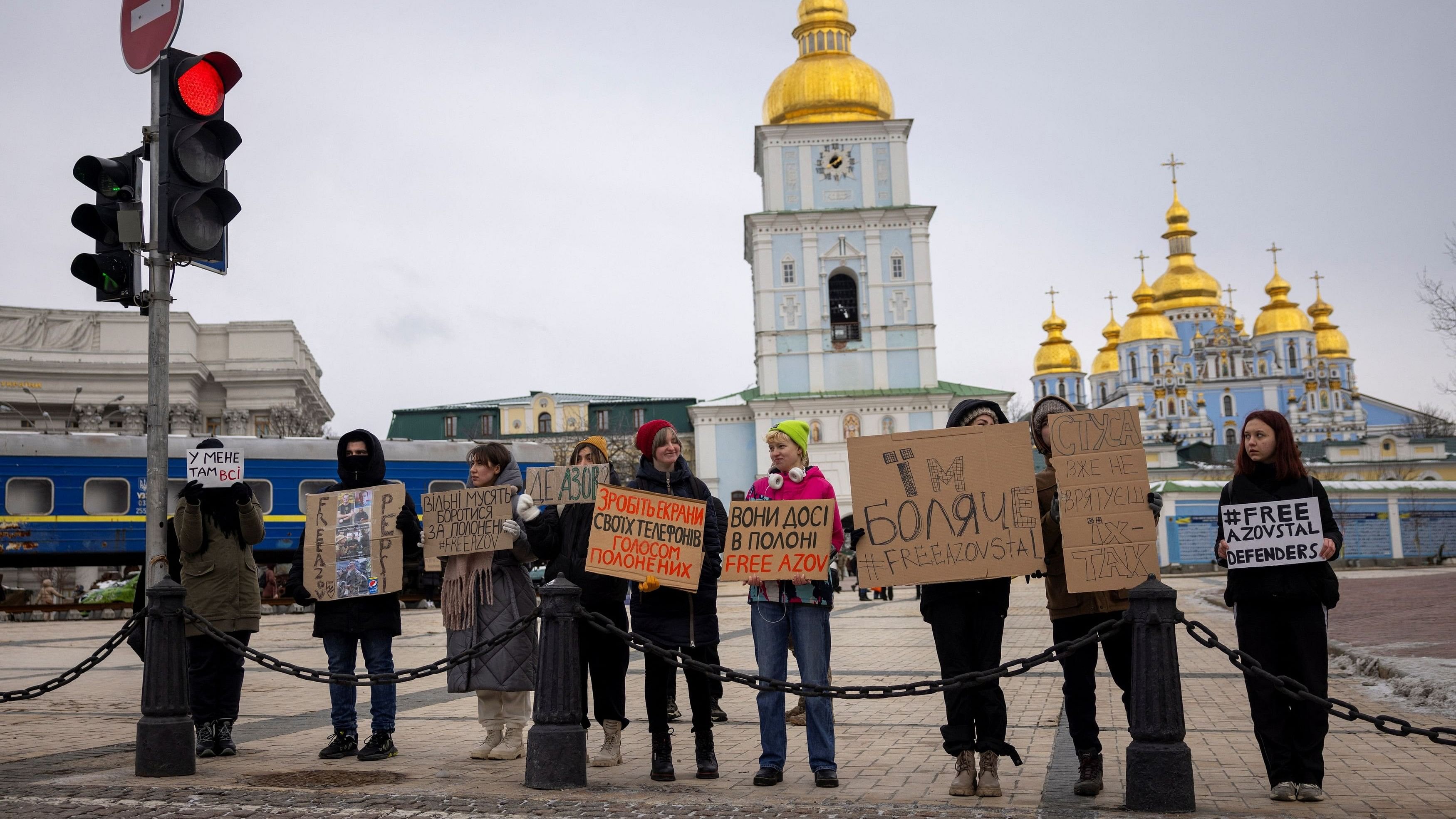 <div class="paragraphs"><p>People hold placards calling for the release of Ukrainian soldiers of the Azov regiment who are held in Russia as prisoners of war in front of St. Michael's Monastery, amid Russia's attack on Ukraine, in Kyiv, Ukraine.</p></div>