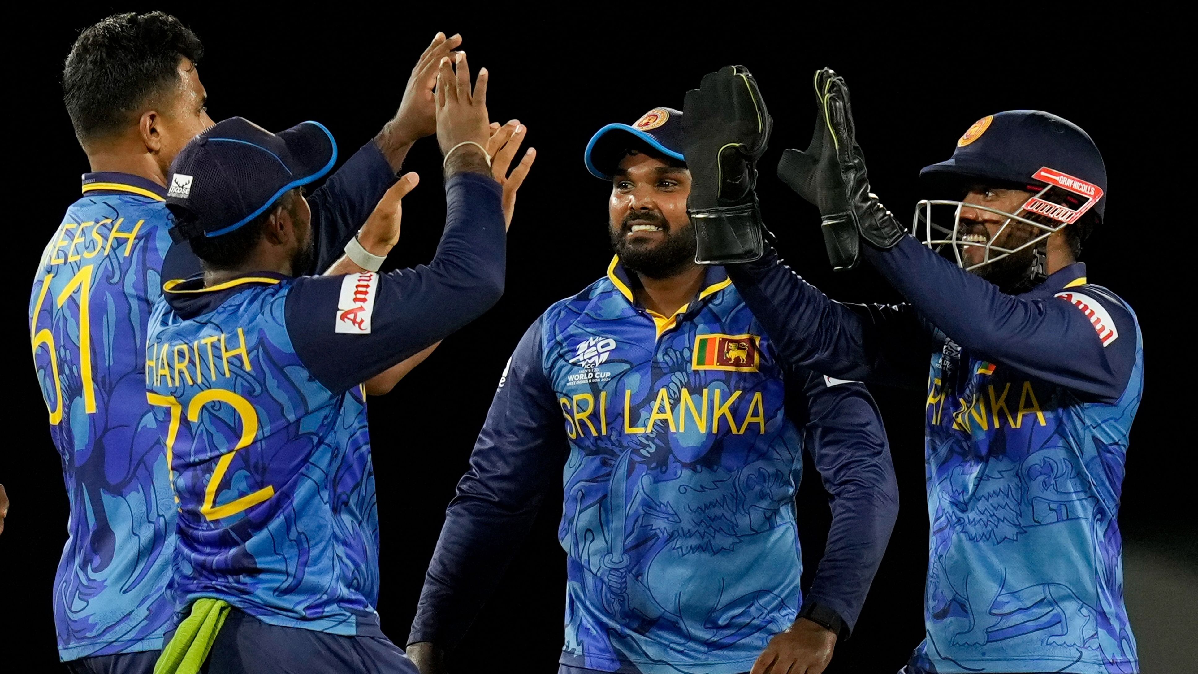 <div class="paragraphs"><p>Sri Lanka's Kusal Mendis right celebrates with teammates after stumping Michael Levitt of the Netherlands during an ICC Men's T20 World Cup cricket match at Daren Sammy National Cricket Stadium in Gros Islet, Saint Lucia, Sunday, June 16, 2024.</p></div>